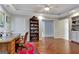 Office space with hardwood floors, built-in bookcases, and an ornate desk at 339 Kensington Dr, Peachtree City, GA 30269