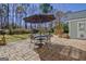 The backyard has a stone paver patio set for outdoor dining at 339 Kensington Dr, Peachtree City, GA 30269