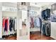 Organized walk-in closet provides ample storage space with custom shelving and clothing racks at 339 Kensington Dr, Peachtree City, GA 30269