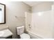 A bathroom with a shower-tub combo, toilet, and single sink vanity at 5345 Bridle Point Pkwy, Snellville, GA 30039