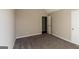An empty bedroom with neutral walls, carpeted floors, and doors and trim painted white at 5345 Bridle Point Pkwy, Snellville, GA 30039