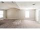 Expansive bedroom with neutral paint, plush carpet, and multiple windows for great natural light at 5345 Bridle Point Pkwy, Snellville, GA 30039