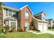 Attractive home showcasing the landscaped front yard, a blend of vinyl siding and brick, and a two-car garage at 5345 Bridle Point Pkwy, Snellville, GA 30039