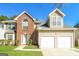 Charming two-story home featuring a brick accent, a two-car garage, and a well-maintained front yard at 5345 Bridle Point Pkwy, Snellville, GA 30039