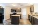 Well-equipped kitchen featuring granite countertops, an island, and sleek black appliances at 5345 Bridle Point Pkwy, Snellville, GA 30039
