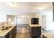 Modern kitchen boasts an open floor plan with granite countertops, an island, and stainless faucet at 5345 Bridle Point Pkwy, Snellville, GA 30039