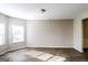Bright bedroom with wood-look floors and plenty of natural light from large windows illuminating the space at 7569 Bowhead Ct, Fairburn, GA 30213