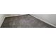 Close up of gray carpet with white trim along the gray wall and base of the floor at 7569 Bowhead Ct, Fairburn, GA 30213