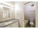 Bathroom featuring a tub/shower combo with granite countertops and tiled shower at 6290 Shallowford Way, Douglasville, GA 30135