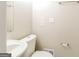 Half bath featuring a pedestal sink and toilet at 6290 Shallowford Way, Douglasville, GA 30135