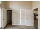 Bedroom showcasing closet space and an open doorway into the kitchen at 6290 Shallowford Way, Douglasville, GA 30135