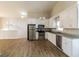Bright kitchen features stainless steel appliances and granite countertops at 6290 Shallowford Way, Douglasville, GA 30135