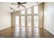 Bright living room with vaulted ceilings, large windows, modern lighting, and wood-look floors at 6290 Shallowford Way, Douglasville, GA 30135