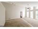 Spacious living room with fan, high ceilings, and large windows at 6290 Shallowford Way, Douglasville, GA 30135
