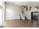 Bright, expansive living room featuring wood-look floors, high ceilings, and ample natural light from large windows at 6290 Shallowford Way, Douglasville, GA 30135