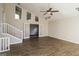Open living room with stairs, french doors, vaulted ceilings, and new wood-look flooring at 6290 Shallowford Way, Douglasville, GA 30135