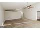 Expansive living room featuring neutral carpet and a ceiling fan at 6290 Shallowford Way, Douglasville, GA 30135