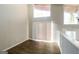 Loft area features wood-look flooring, modern lighting, and natural light from large windows at 6290 Shallowford Way, Douglasville, GA 30135