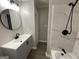 Modern bathroom with a vanity, new fixtures, and a bathtub featuring stylish tile work at 9491 Hidden Branch Dr, Jonesboro, GA 30236