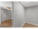 Neutral bedroom with wood-look flooring and ceiling fan with connecting room at 9491 Hidden Branch Dr, Jonesboro, GA 30236