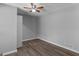 Empty bedroom featuring wood-look floors and ceiling fan at 9491 Hidden Branch Dr, Jonesboro, GA 30236