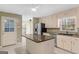 Bright kitchen with granite counters, stainless steel appliances, and ample storage at 9491 Hidden Branch Dr, Jonesboro, GA 30236