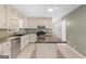 Traditional kitchen featuring stainless steel appliances, ample cabinets, and a central island at 9491 Hidden Branch Dr, Jonesboro, GA 30236
