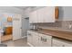 Open kitchen with plentiful cabinets and standard appliances at 9491 Hidden Branch Dr, Jonesboro, GA 30236