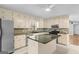 Traditional kitchen featuring stainless steel appliances, ample cabinets, and a central island at 9491 Hidden Branch Dr, Jonesboro, GA 30236