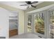 Sun room with bright sunlight from large windows and a walk in closet at 9491 Hidden Branch Dr, Jonesboro, GA 30236
