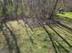 Large grassy backyard with chain link fence backing up to wooded area and play set at 946 Creek Run Pl, Temple, GA 30179