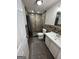 Tiled bathroom with shower and tub and vanity with sink at 946 Creek Run Pl, Temple, GA 30179