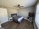Bedroom with a bed, ceiling fan, and a television stand at 946 Creek Run Pl, Temple, GA 30179