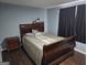 Bedroom with wood floors, queen bed, and a nightstand at 946 Creek Run Pl, Temple, GA 30179