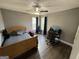 Bedroom with wooden bedframe and desk at 946 Creek Run Pl, Temple, GA 30179