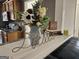 Cozy living room decor with floral arrangement, books, and a decorative 