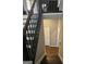 View of the staircase featuring dark wood and white risers leading to the next level at 946 Creek Run Pl, Temple, GA 30179