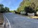 View of the neighborhood street and community sign at 946 Creek Run Pl, Temple, GA 30179