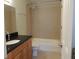This bathroom features tile flooring and shower surround and a black granite countertop at 117 Rondak Se Cir, Smyrna, GA 30080