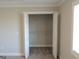 This is a walk-in closet with white wire shelving and bi-fold doors at 117 Rondak Se Cir, Smyrna, GA 30080