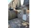 A fenced-in back patio features a brick wall and a door leading to the interior of the home at 117 Rondak Se Cir, Smyrna, GA 30080