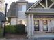 Charming brick townhouse with covered entrance, well-maintained landscaping, and inviting front door at 117 Rondak Se Cir, Smyrna, GA 30080