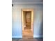 Bright hallway featuring wood-look flooring, neutral walls, and recessed lighting at 117 Rondak Se Cir, Smyrna, GA 30080
