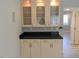 Stylish kitchen with sleek cabinetry, granite countertops, and glass-front display cabinets at 117 Rondak Se Cir, Smyrna, GA 30080