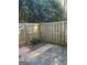 Back patio with wooden fence and a gate to additional outdoor space at 117 Rondak Se Cir, Smyrna, GA 30080