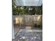 Back patio with a wooden fence and a gate leading to additional outdoor space at 117 Rondak Se Cir, Smyrna, GA 30080