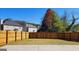 Picture of a spacious backyard with full fencing with mature trees along the border at 7926 Palomino Pass, Riverdale, GA 30274