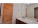 Bathroom featuring double sinks, large mirrors, and a shower and tub combination at 7926 Palomino Pass, Riverdale, GA 30274