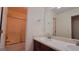 Bathroom featuring double sinks, large mirrors, and a shower and tub combination at 7926 Palomino Pass, Riverdale, GA 30274