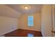 Bright bedroom featuring hardwood floors, textured ceiling and natural light from a window at 7926 Palomino Pass, Riverdale, GA 30274